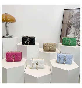 Fashionable quilted PU leather chain shoulder crossbody bag with metallic lock detail.