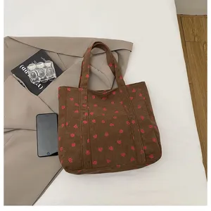 Brown corduroy tote bag with cute pink strawberry print, large capacity shoulder bag for daily use.