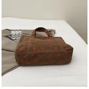 Brown corduroy strawberry print tote bag detail view, casual large capacity shoulder bag.