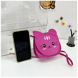 Close-up view of pink cute cat cartoon mini crossbody bag for kids girls fashion accessory.