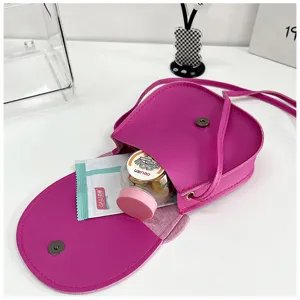 Pink mini crossbody bag for women, cute PU leather shoulder bag with flap and magnetic closure.