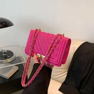 Pink quilted shoulder bag with gold chain strap, stylish crossbody bag for women daily wear.