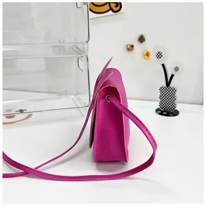 Pink mini crossbody bag for women and girls, cute shoulder bag with adjustable strap.