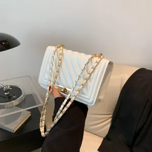 White quilted chain shoulder bag for women, elegant crossbody bag with metal lock.