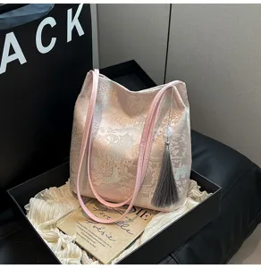 Chinese style landscape embroidery tote shoulder bag with tassel detail for women daily use.