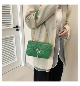 Stylish green quilted shoulder bag for women with gold chain and metal S clasp design.