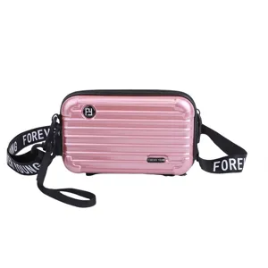 Pink mini suitcase crossbody bag for women, stylish hard shell shoulder bag with strap.