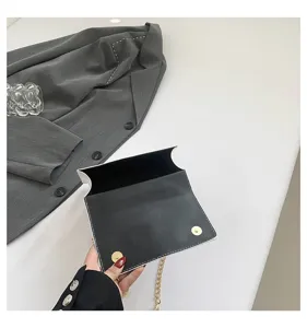 Women's black and white envelope chain bag fashion small square crossbody bag for daily wear.