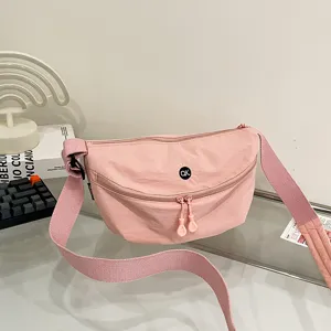 Stylish minimalist pink dumpling shoulder bag for women, ideal for daily commuting use.
