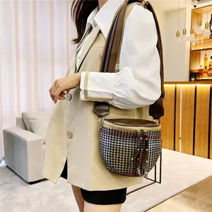 Stylish houndstooth crossbody bag for women, trendy wide strap shoulder bag detail view.