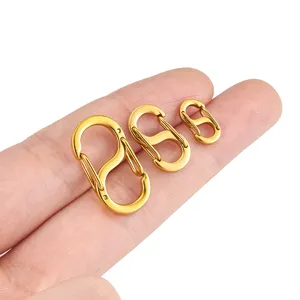 Stainless steel S-shaped spring buckle detail showing size comparison on hand for DIY.
