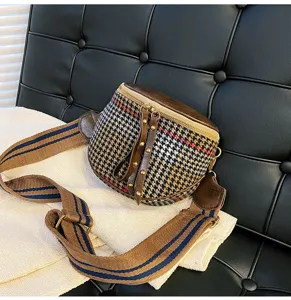 Stylish houndstooth crossbody bag for women with wide strap, retro chic design, perfect detail.