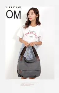 Casual women's canvas shoulder bag, fashionable large capacity tote with zipper pocket.