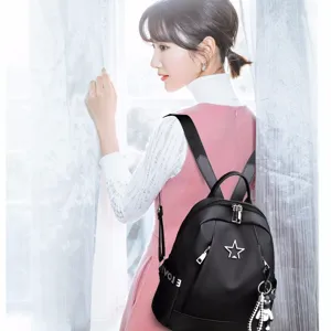 Stylish women's oxford cloth backpack casual fashion school bookbag with star decor and charm.