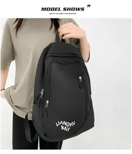 Unisex minimalist nylon backpack large capacity stylish school bag with front zipper pockets.