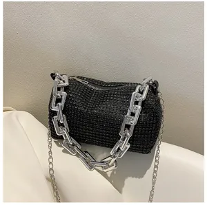 Black rhinestone underarm bag with bold silver chunky chain, sparkling crystal detail.