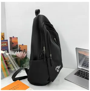 Minimalist black nylon backpack, large capacity school bag with multiple pockets and durable straps.