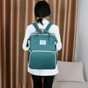 Grand sac à dos à langer pour maman, sac de maternité multifonctionnel bleu sarcelle confortable.