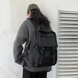 Japanese dark style casual canvas backpack with large capacity for daily commute and school use.
