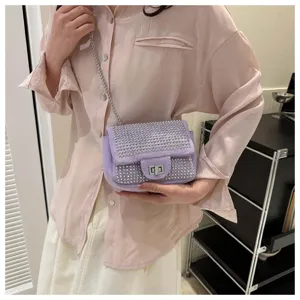 Chic rhinestone mini shoulder bag for women, stylish purple crossbody bag with chain strap.