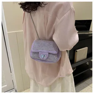 Rhinestone shoulder bag detail showing sparkle and chain strap design for stylish women.