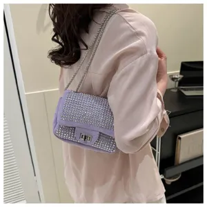 Detailed view of rhinestone shoulder bag, purple crystal crossbody purse with chain strap.