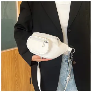 Close-up detail of white PU leather waist bag with zipper pockets and metal chain.
