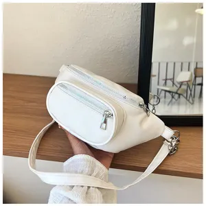 White PU leather fanny pack detail shot showing zipper pocket and metal chain accessory.
