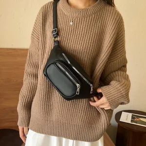 Black PU leather fanny pack for women, stylish crossbody waist bag with zip pockets.