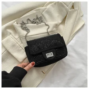Rhinestone flap chain shoulder bag detail shot, black evening bag with silver hardware.
