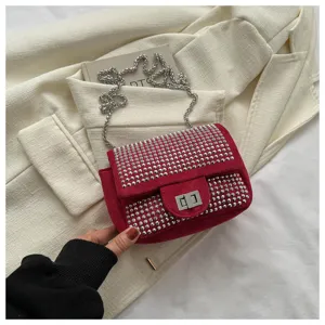 Red rhinestone studded chain shoulder bag, stylish evening cross body bag detail.