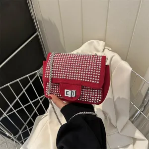 Red rhinestone studded shoulder bag for women, stylish diamond crossbody bag with chain strap.