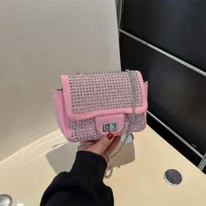 Pink rhinestone crossbody bag for women, stylish studded shoulder bag with chain strap.