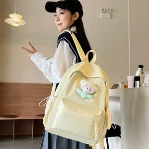 Japanese style solid color canvas backpack for women school cute bag with plush pendant.