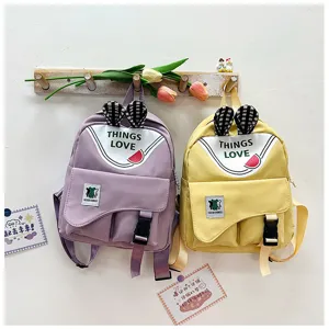 Cute macaron color children backpack with rabbit ears, sweet style school bag for kids.