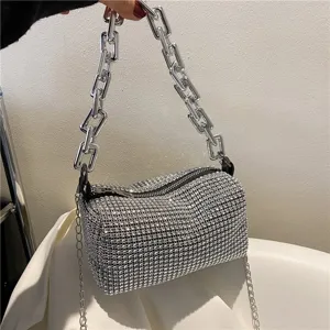 Detailed view of the sparkling rhinestone underarm bag featuring a chunky silver chain handle.