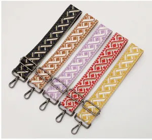 Detailed close-up view of colorful woven replacement bag straps featuring adjustable metal hardware.