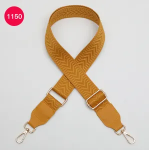 Adjustable wide replacement bag strap with herringbone pattern and leather ends for crossbody.