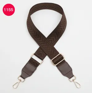Adjustable woven bag strap with leather ends and gold hardware for crossbody replacement.