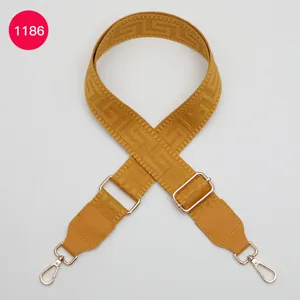 Adjustable replacement wide bag strap with geometric pattern, durable PU leather and gold hardware.