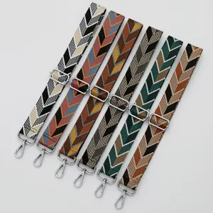 Wide ethnic style woven bag strap replacement crossbody shoulder bag accessory with metal buckles.