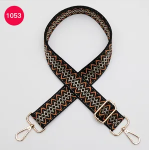 Adjustable replacement bag strap with woven geometric pattern and gold hardware for crossbody.