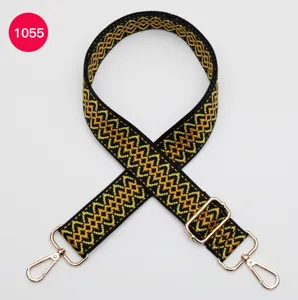 Close-up view of the woven replacement bag strap with metallic buckles and adjustable hardware.