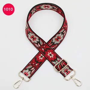 Ethnic style jacquard bag strap with floral pattern and gold metal hooks for crossbody bags.