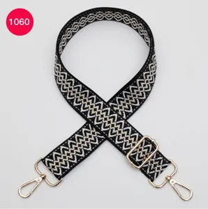 Adjustable replacement shoulder strap for crossbody bags, black and white geometric pattern.