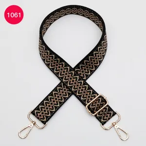 Adjustable replacement bag strap, woven geometric pattern with gold metal hardware details.