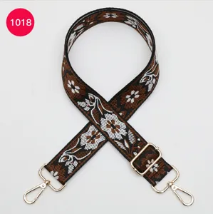 Colorful ethnic style woven bag strap with floral jacquard, metal hooks and adjustable buckle.