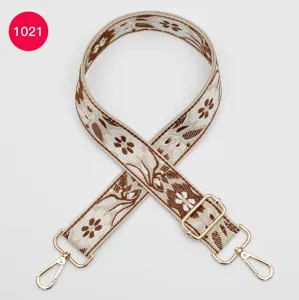 Ethnic style jacquard wide bag strap with floral pattern and gold hardware. Perfect accessory.