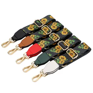 Adjustable replacement bag strap set, stylish sunflower print canvas with gold hardware.