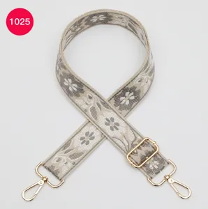 Woven ethnic style floral bag strap with gold hardware, wide adjustable crossbody replacement.
